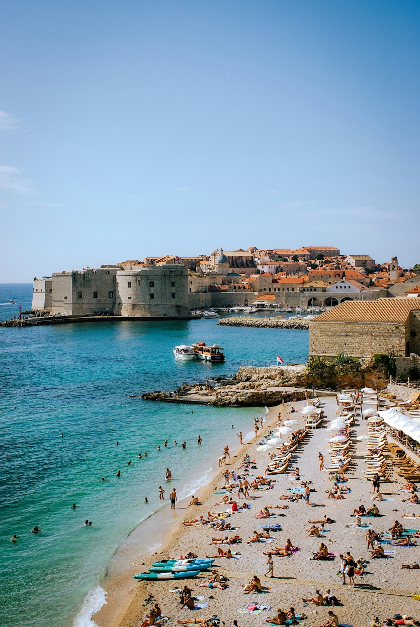 Croatian coastline with historic harbour town and turquoise water