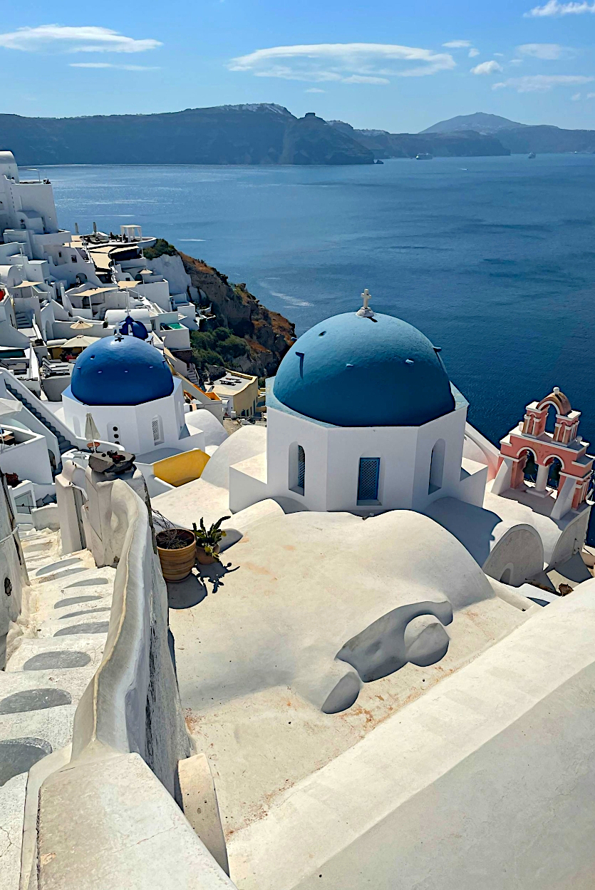 Whitewashed Greek island villas overlooking the Aegean Sea
